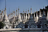 Myanmar - Mandalay, Sandamuni Pagoda. The entire ground is covered with 1749 small white pagodas with stone slabs with the Buddhist Tripitaka. 